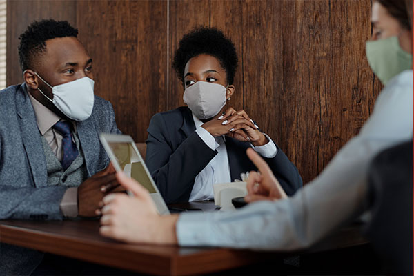 Business meeting with masks